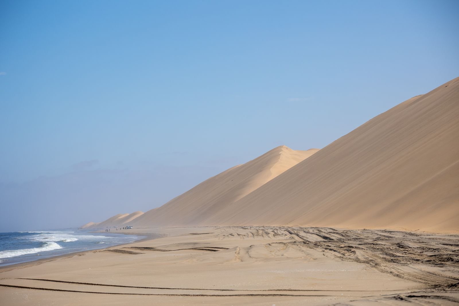 Sand dunes meeting the Atlantic Ocean on the coast of Namibia